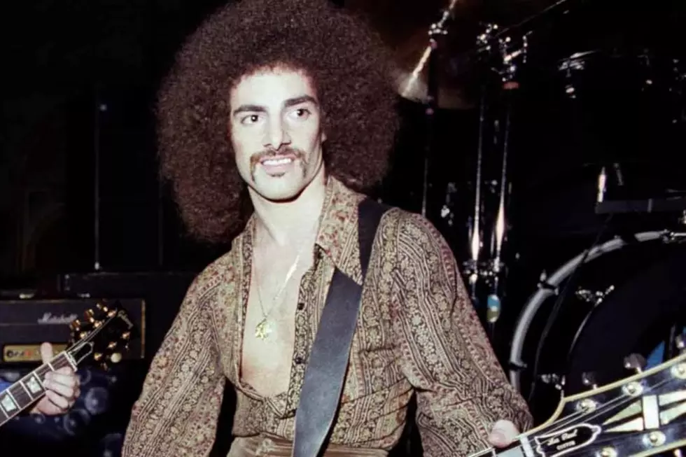 Co-founding guitarist Neal Schon playing an early-era Journey concert. (Ed Perlstein/Redferns, Getty Images)