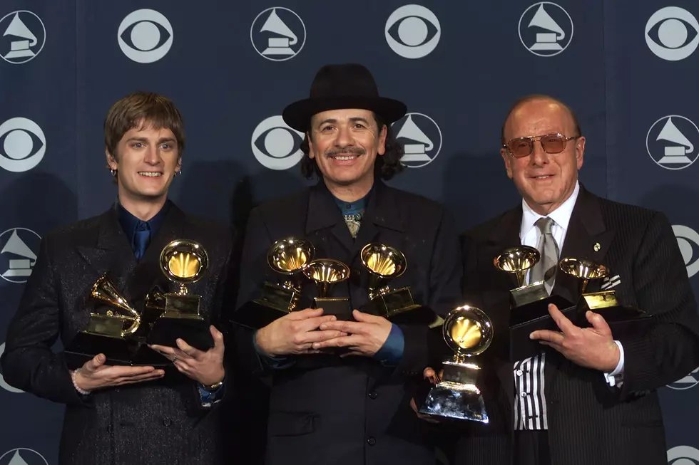 Rob Thomas, Carlos Santana and Clive Davis at the 2000 Grammy Awards. (Scott Gries, Getty Images)