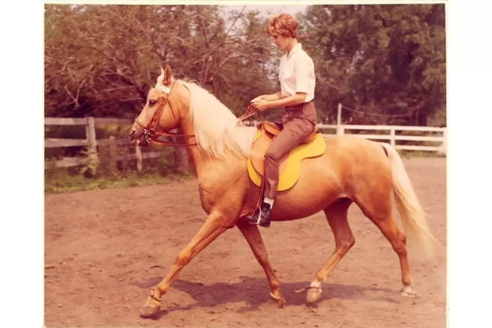 Family photo that shows woman riding horse in 1960s