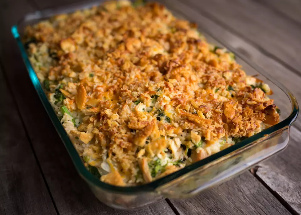 A tuna casserole sitting on a a dinner table ready to be devoured.