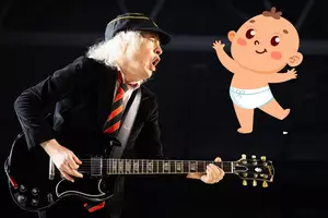 Angus Young Signs Baby at Surprise Toronto Pop Up Appearance