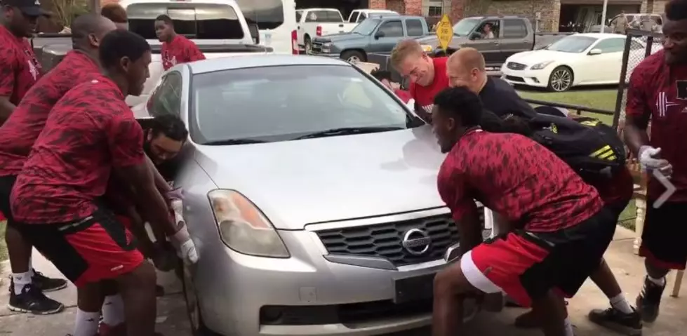Ragin Cajuns Football Team Lifts A Car During Cleanup Efforts [Video]