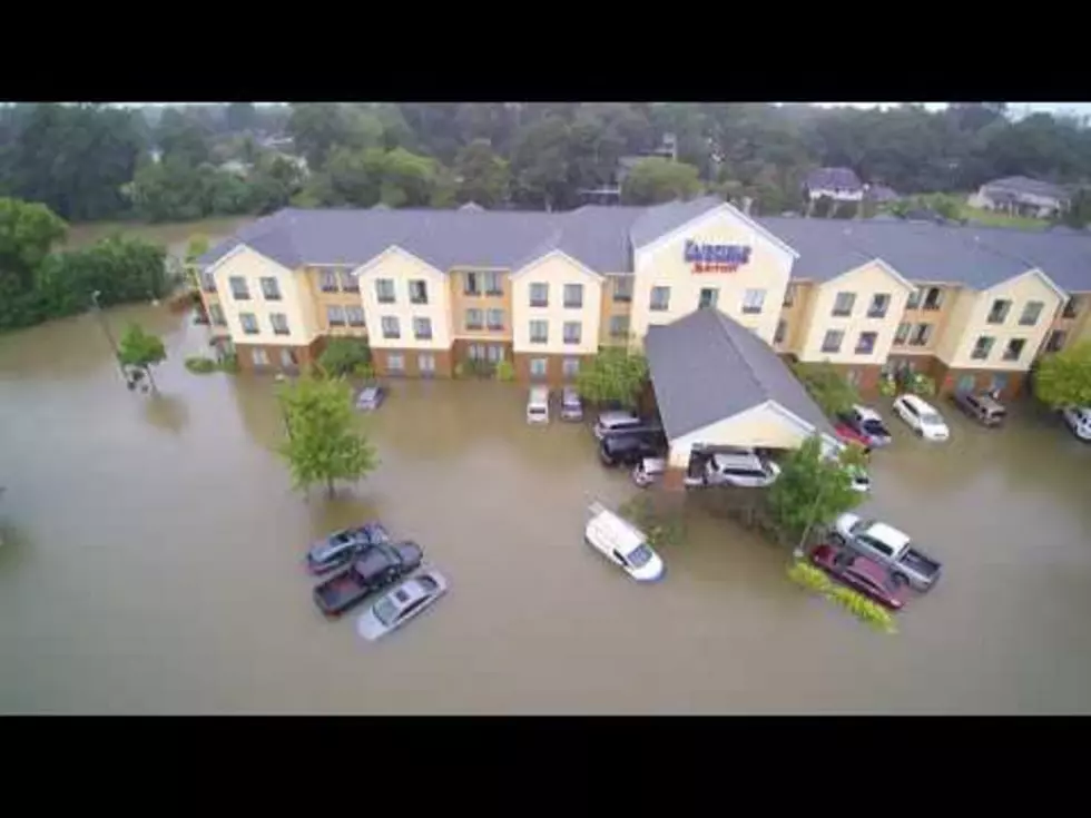 Aerial Footage of Flooded Hotels and Outback Steakhouse Near River in Lafayette [Video]