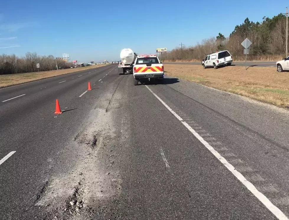 Truck Carrying Motor Oil Disconnects On I-10