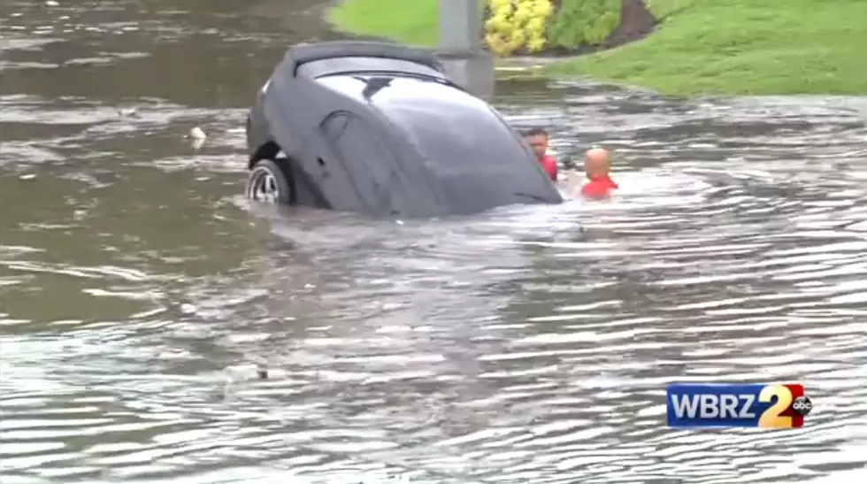 Baton Rouge Firefighters Break Window To Rescue Woman Being Carried Away In Flood [Video]