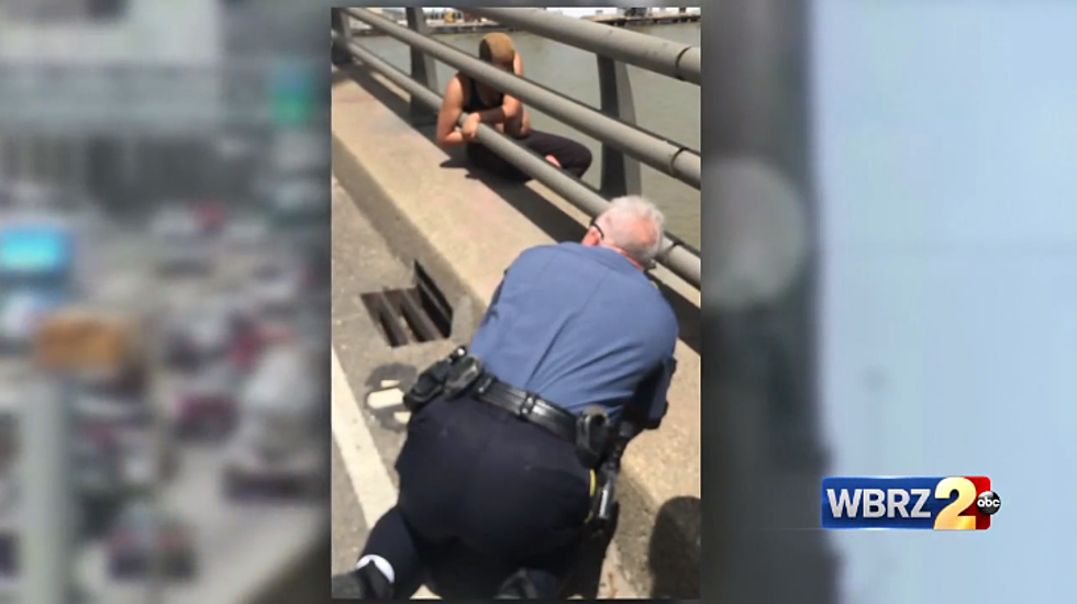 Baton Rouge Deputy Makes Daring Rescue of Woman Threatening to Jump From Mississippi River Bridge