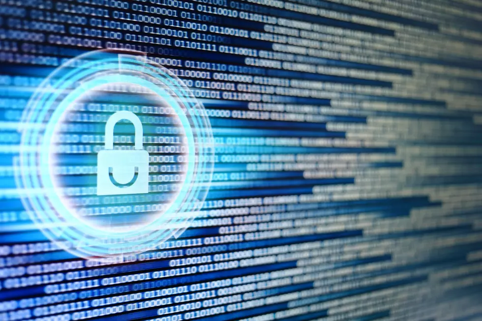 padlock icon on LED computer display screen with binary code moving in the background. password and data privacy protection in internet data transfer concepts. cyber network security blue color.