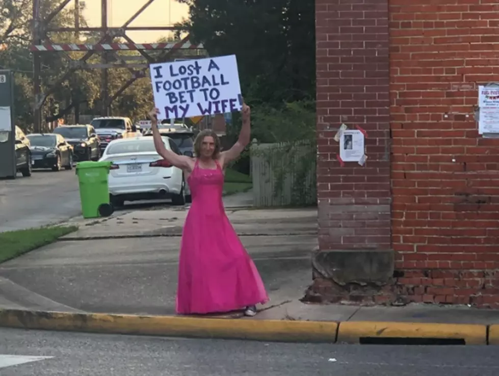 Breaux Bridge Man Loses Bet, Forced to Stand on Street Corner in a Pink Dress