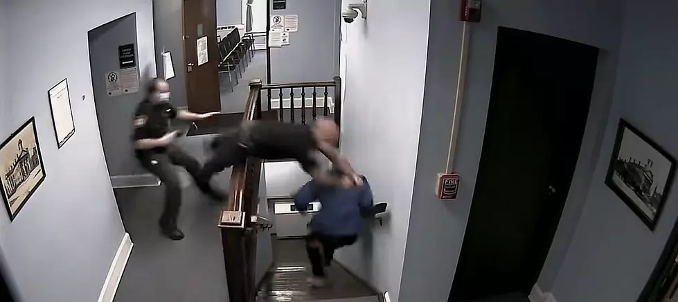Police Officer Dives Over Staircase Railing to Catch Man Escaping Courthouse [Video]