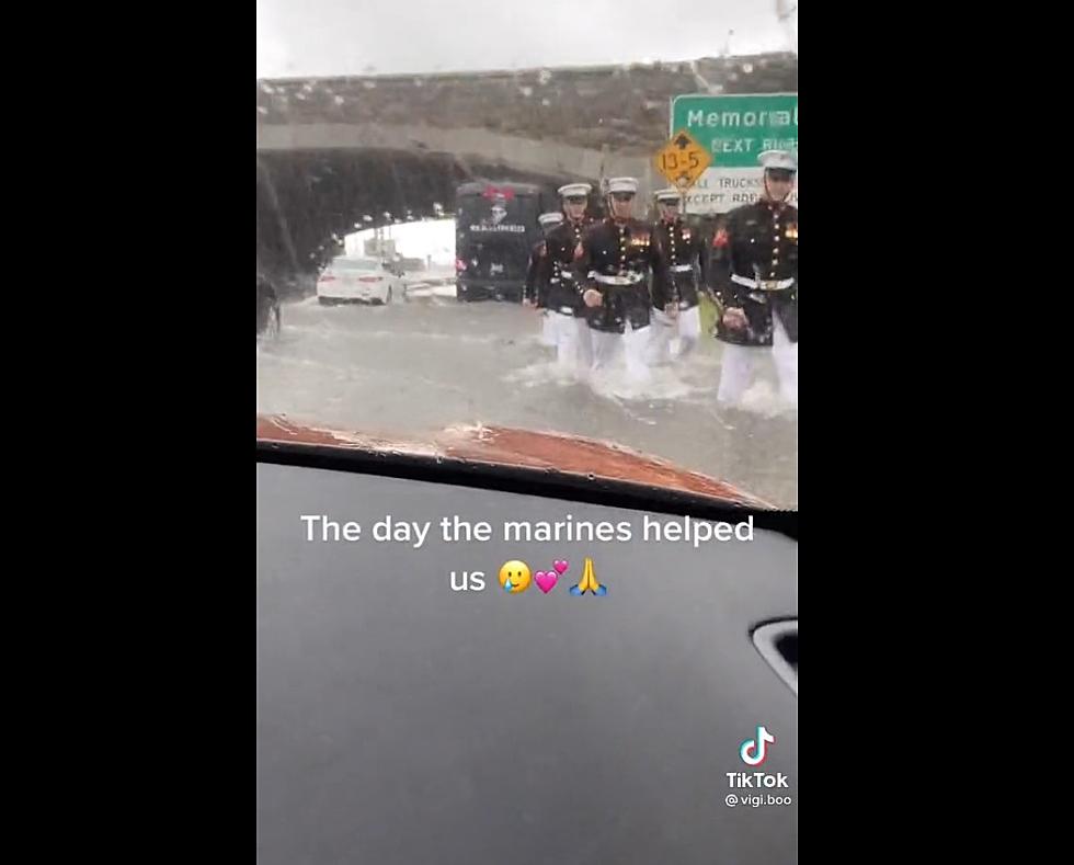 Marines in Full Dress Blue Uniforms Push Car Out of Flood Waters