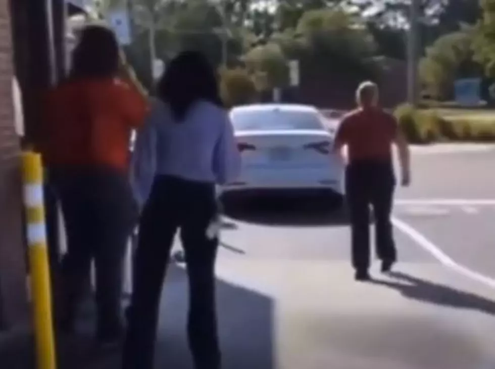 Woman Screams at Drive Thru Worker While Car Rolls Into Ditch