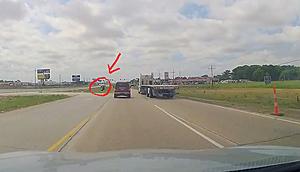Insane Video From Highway 90 Shows Tire Flying Off Dump Truck...