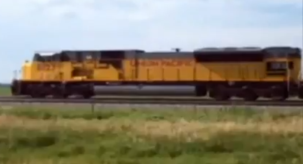 Crazy Man Yells At Trucks, Trains, And Automobiles [VIDEO]