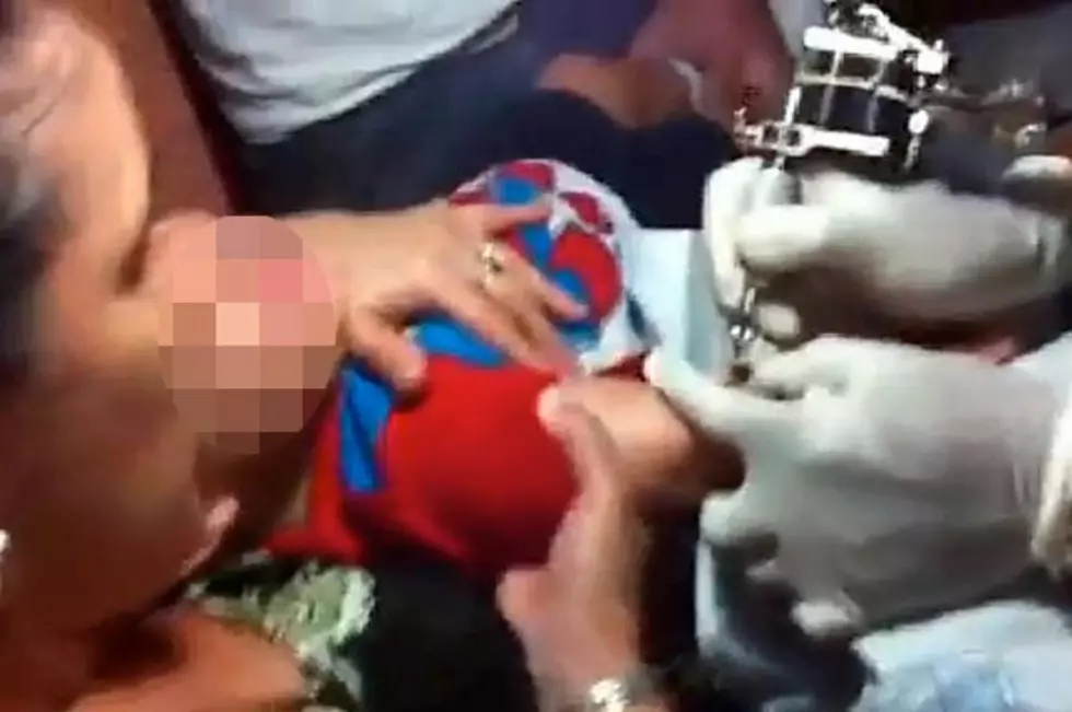 Mother Forces Her Screaming Baby To Get Tattoo [VIDEO]