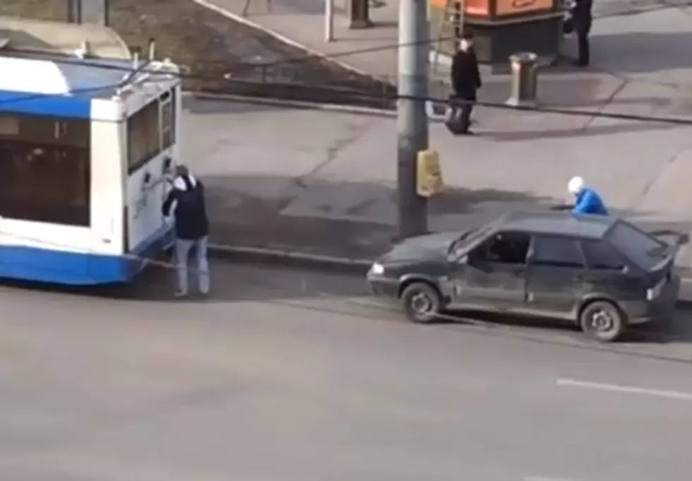 Two Idiots Strap Their Car To A Bus, But Fail To Steer It [VIDEO]