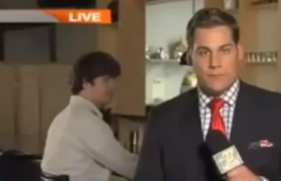 Guy Videobombs News Crew By Drinking From Flower Vase During &#8216;Live Shot&#8217; [VIDEO]