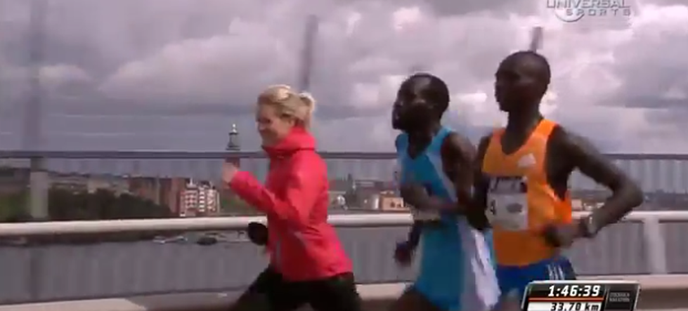 Reporter Tries To Interview Two Marathon Runners During A Race [VIDEO]