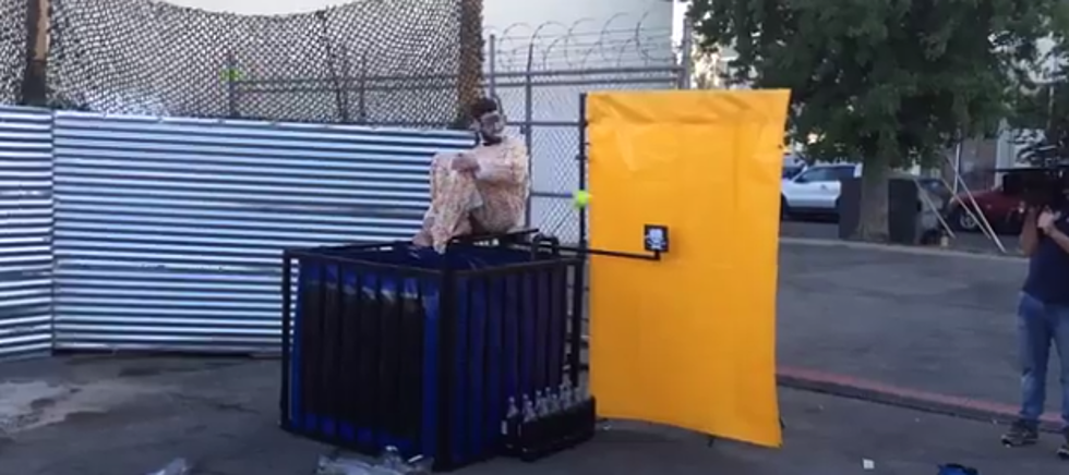 Guy Gets Dunked Into A Tank Full Of Diet Coke Wearing A Mentos Suit [VIDEO]