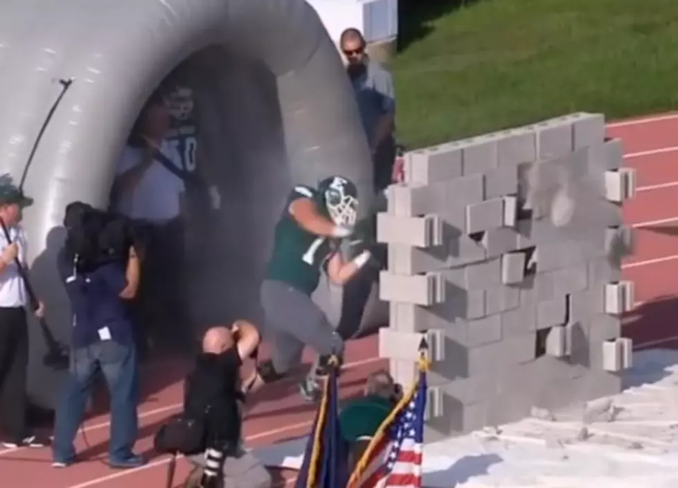Eastern Michigan Football Team Tries To Destroy Cinder Block Wall During Entrance Onto Field [VIDEO]
