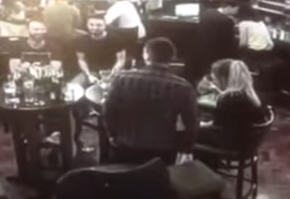 Man Tries To Cozy Up With Woman At Bar, Then Falls Off Chair [VIDEO]