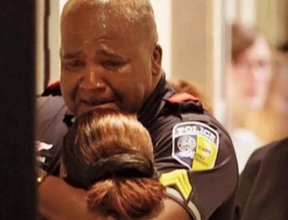Dallas Police Officer Consoled At Hospital [PHOTO]