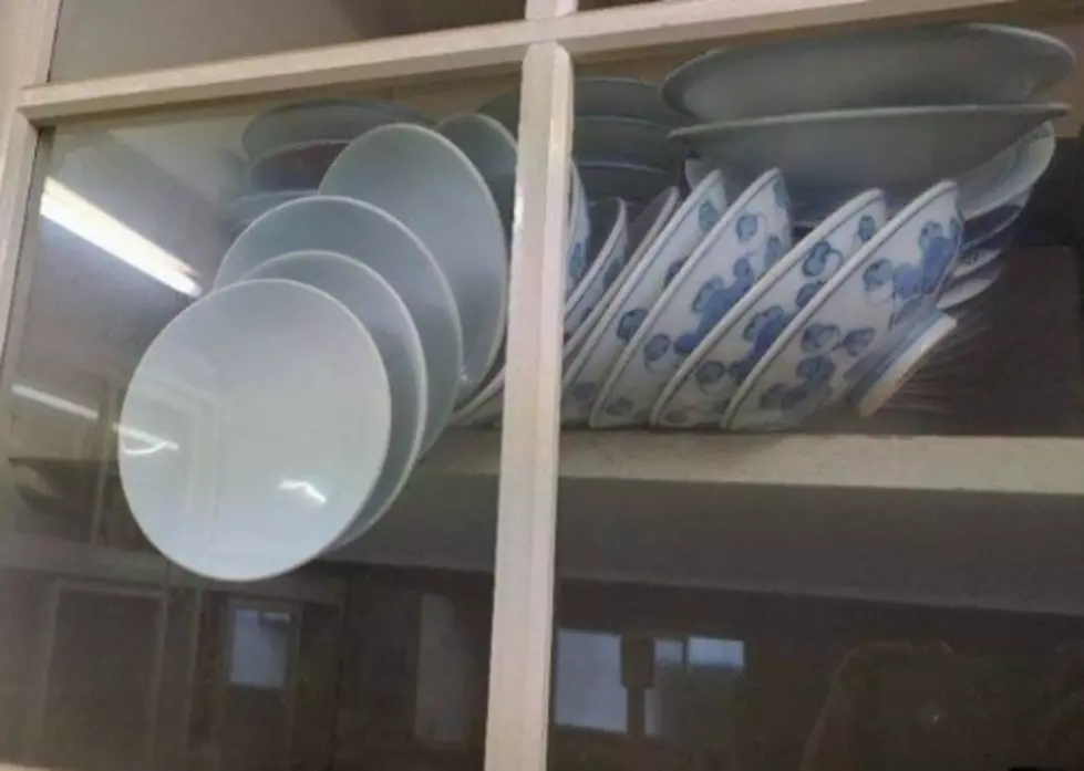 The Internet Reacts To Photo Of Dishes In Cupboard