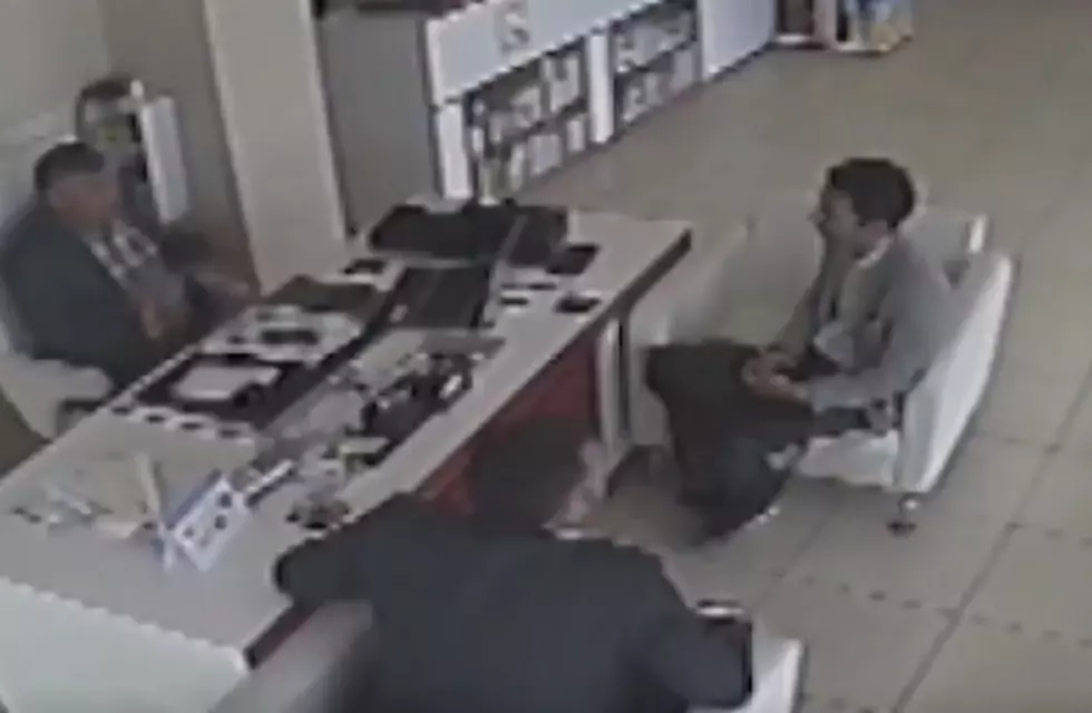 Runaway Tire Hits Two Men Sitting In Store [VIDEO]