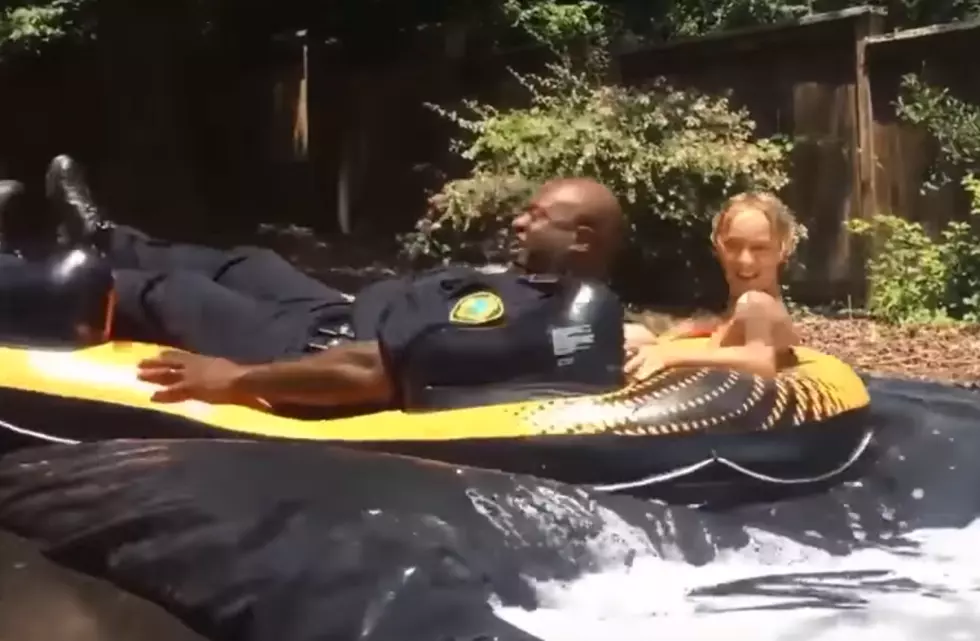 Police Officers End Up Taking A Ride On The Slip-N-Slide They Were Called To Shut Down [VIDEO]