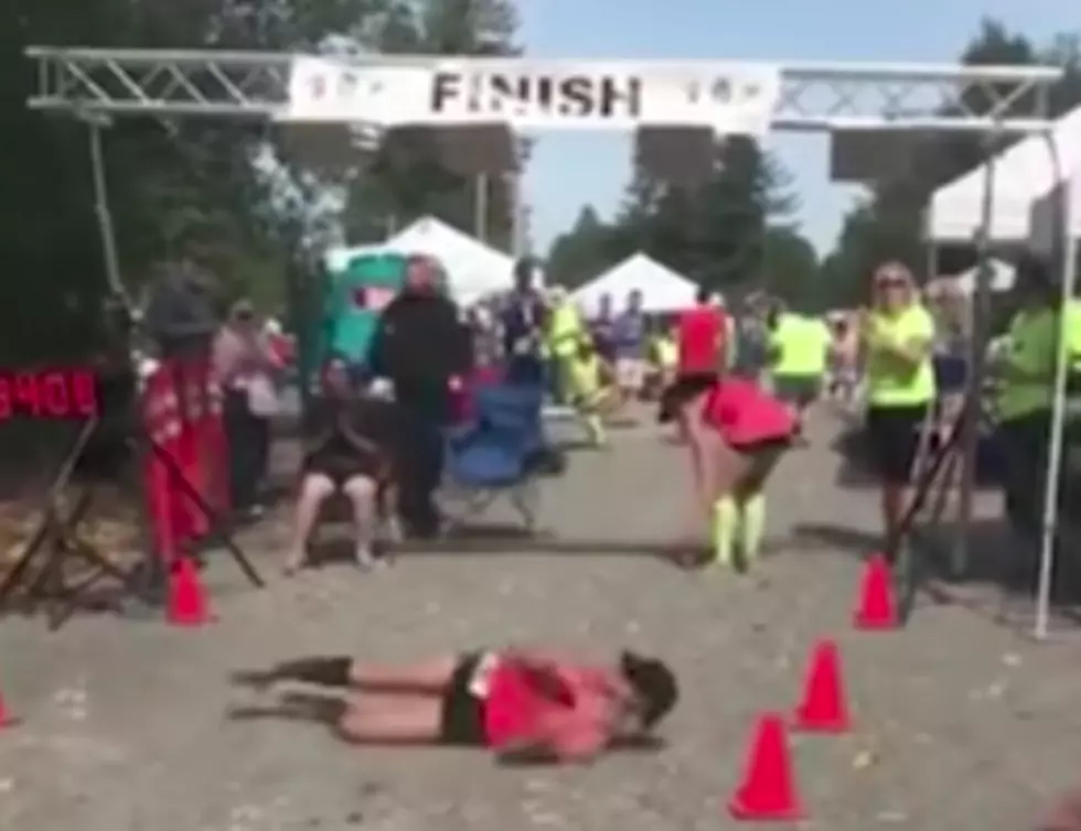 Marathon Runner Rolls Across Finish Line [VIDEO]