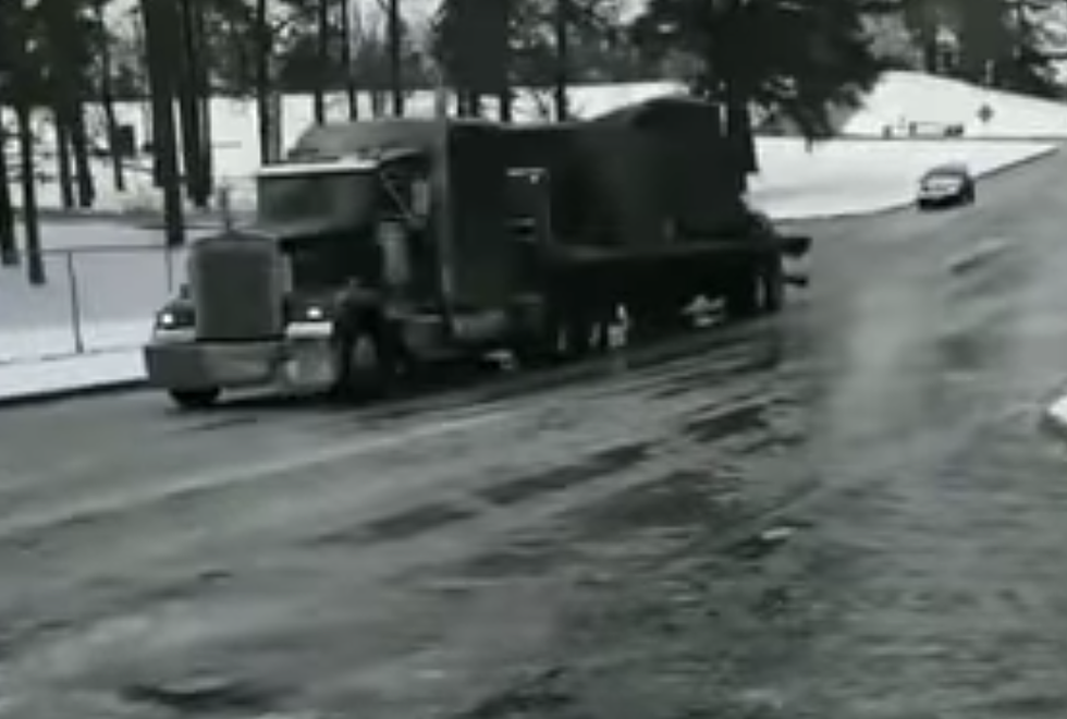 18-Wheeler Slides Backwards On Frozen Road, Hits Stoplight [VIDEO]