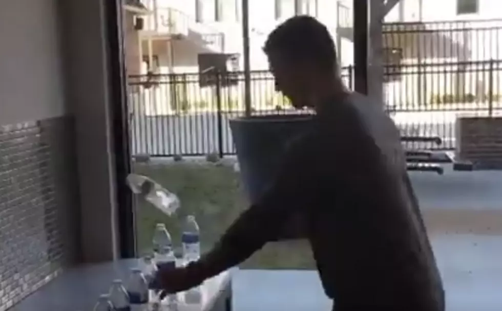 Guy Flips And Lands 63 Water Bottles In One Minute [VIDEO]