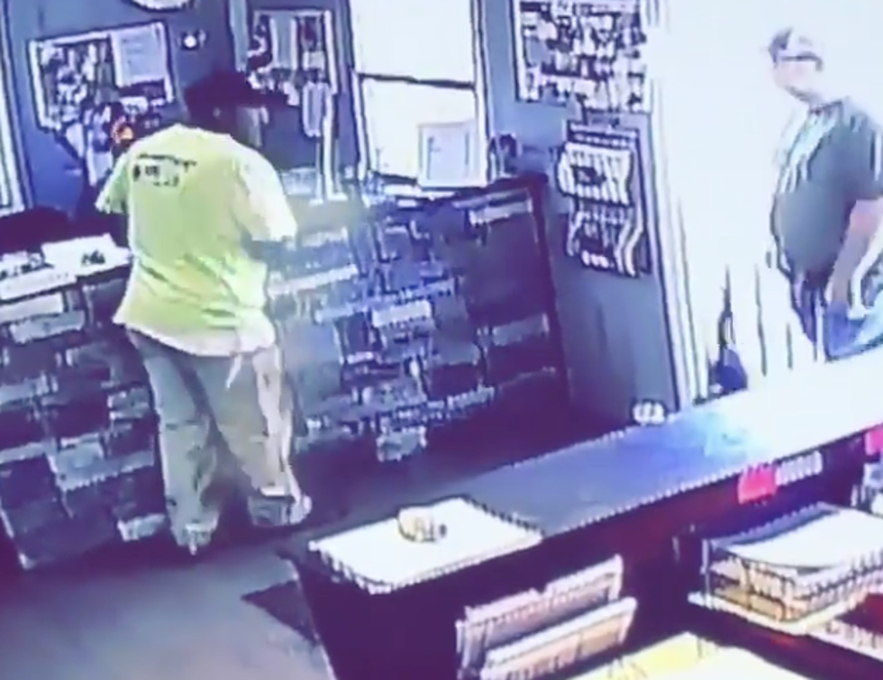 Man Jumps On Counter When Cat Runs Into Store [VIDEO]