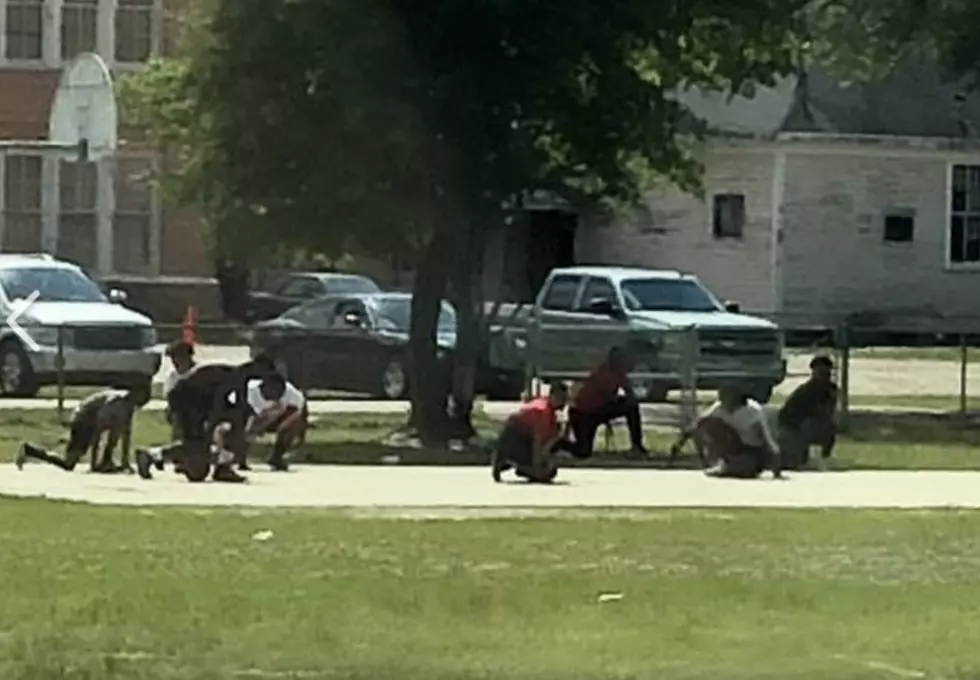Basketball Players Kneel As Funeral Procession Passes School [PHOTO]