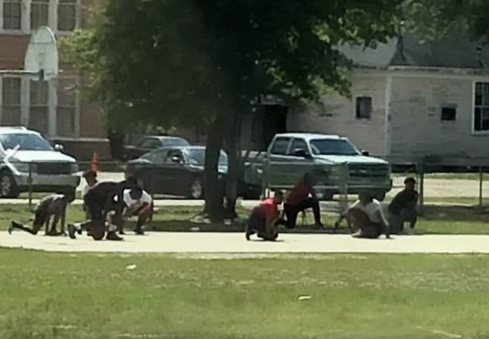 Basketball Players Kneel As Funeral Procession Passes School [Photo]