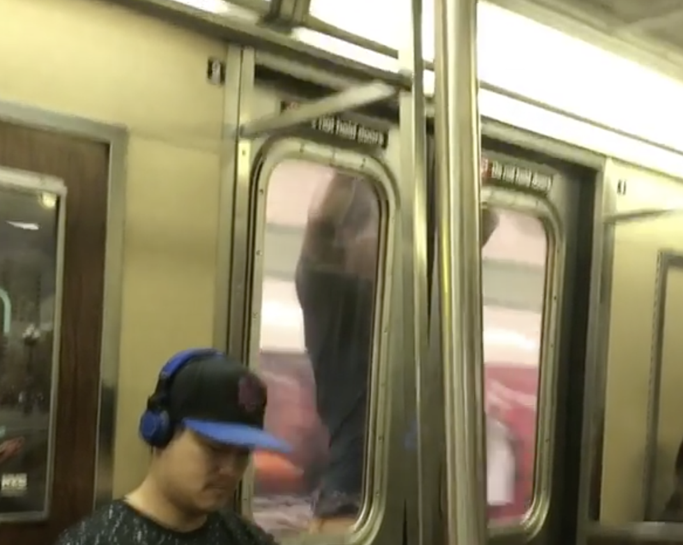 Guy Clings To Moving Subway Car [VIDEO]