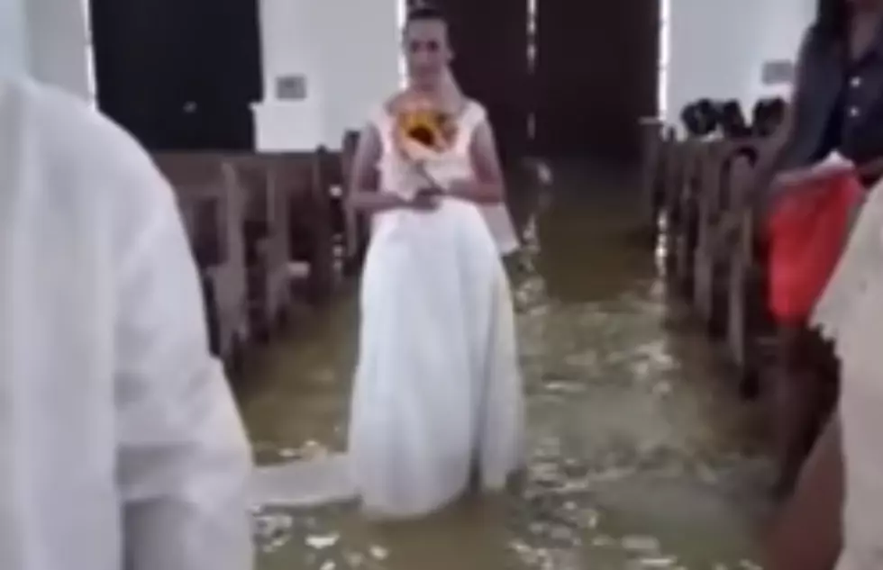 Bride Walks Down The Aisle In Flooded Church [VIDEO]
