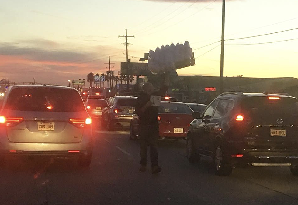 Photo Of Baton Rouge Man Selling Cotton Candy In Traffic Goes Viral