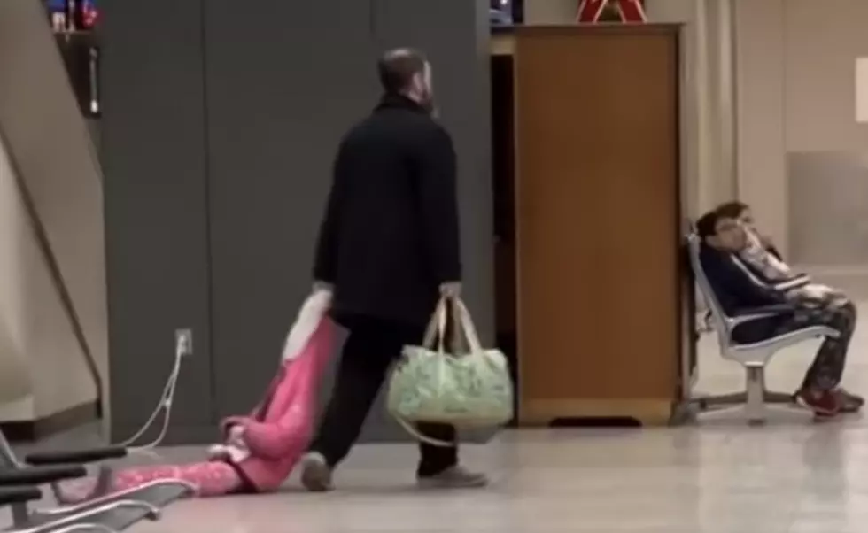 Man Drags Kid Through Airport [VIDEO]