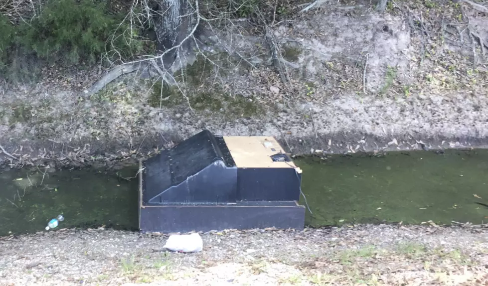 Someone Threw A Big Screen Television In A Ditch In Scott [PHOTOS]