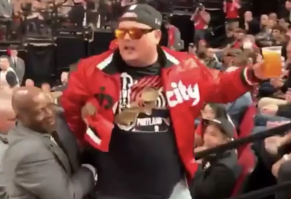 Fan Chugs Beer While Being Escorted Out Of Arena [VIDEO]