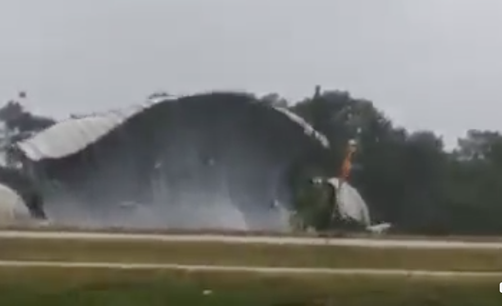 Wild Video Shows Entire Plane Hangar Rolling Down Hwy 90