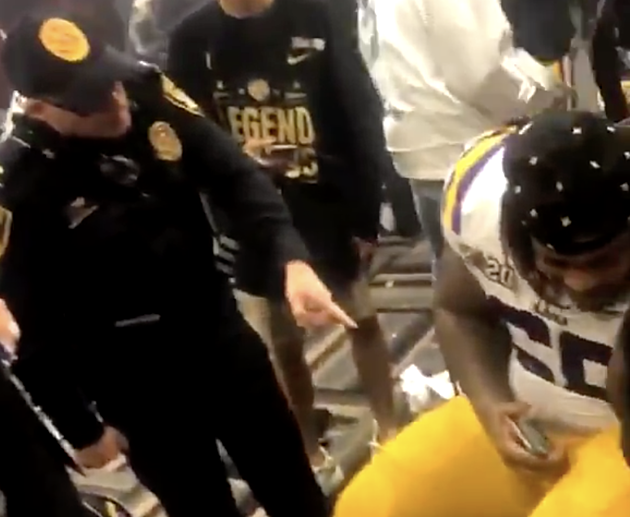 Police Officer Spotted In LSU Locker Room After Championship Game [VIDEO]