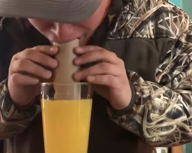Guy Tries To Drink Orange Juice From Cardboard Tube Video