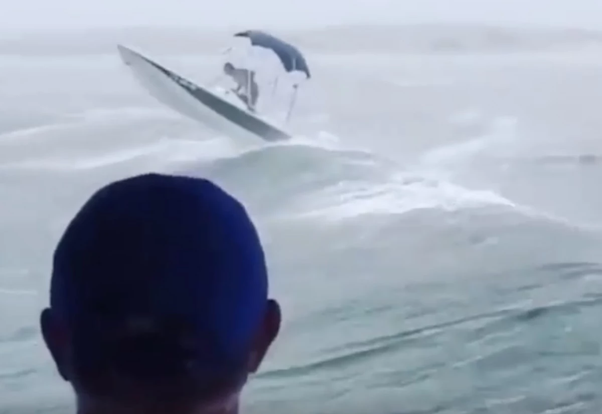 Man in Boat Attempts to Ride Waves During Hurricane Sally [VIDEO]