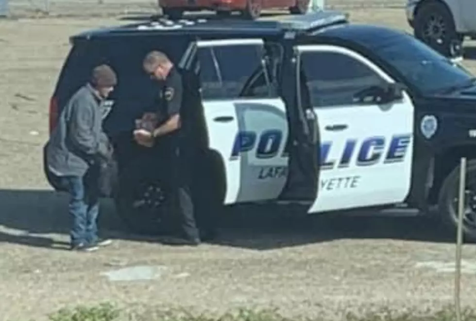 Lafayette Police Officer Seen Giving Groceries to Homeless Person [PHOTO]