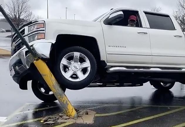 Airbag Deploys After Man Gets Truck Off of Parking Lot Pole [VIDEO]