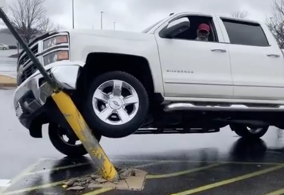 Airbag Deploys After Man Gets Truck Off of Parking Lot Pole [VIDEO]