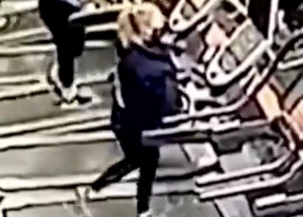 Woman Falls Off of Treadmill While Trying to Remove Sweater [VIDEO]