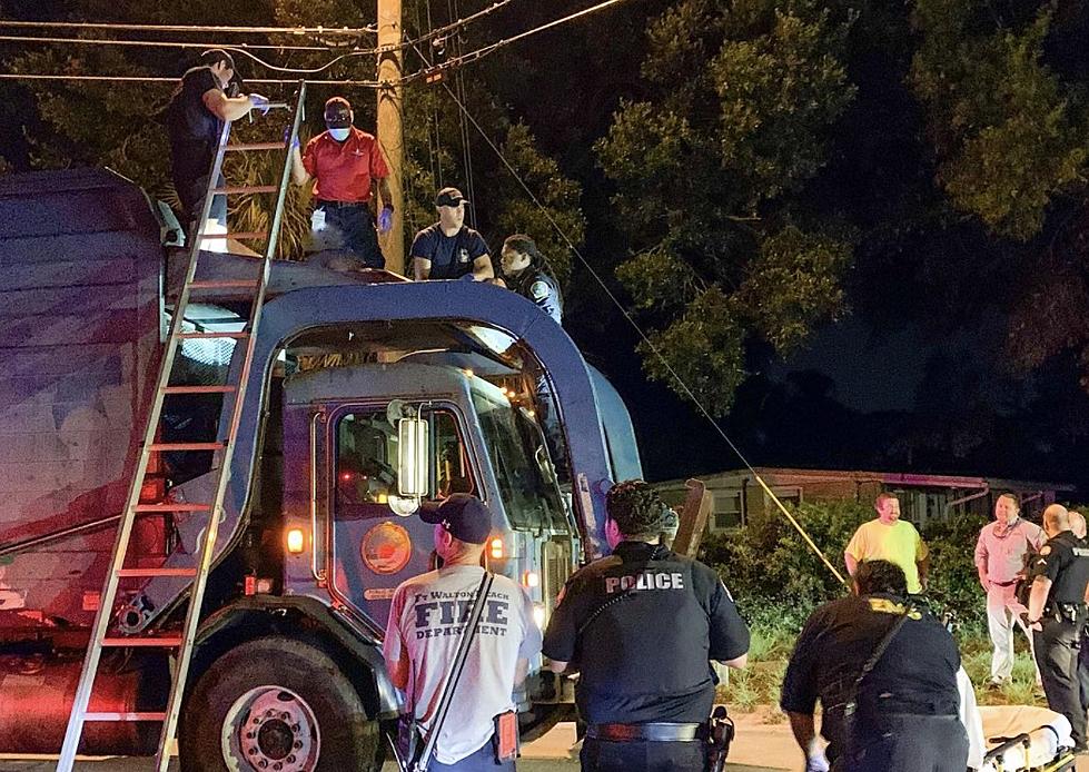 Fire Department Rescues Person From Waste Disposal Truck