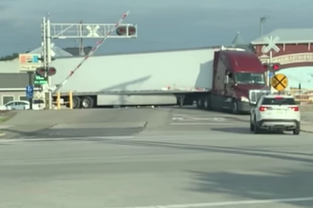 Semi Slams Into Truck That is Stopped on Railroad Tracks [VIDEO]